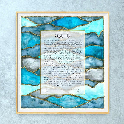 A ketubah with blue watercolors with gold leaf added by hand, personalized with couple's names. 